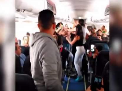 WATCH:Female plane passengers filmed trading blows in vicious fight over 'loud music' on packed flig