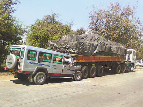 Pick-up entered  parked truck , 11 injured