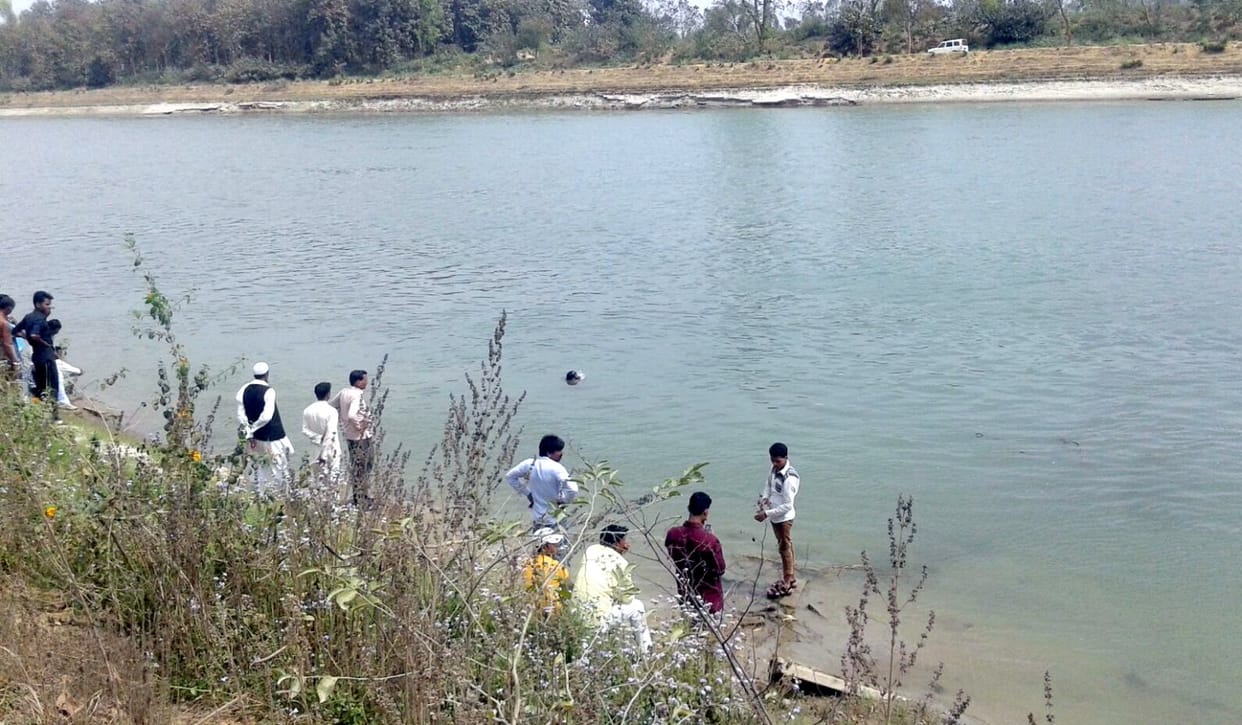 Young woman jumps in canal