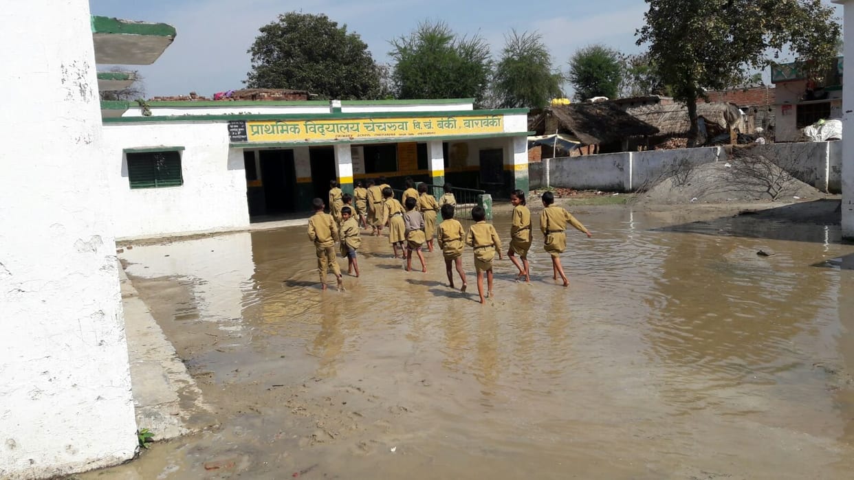 The children take the test through overflowing water