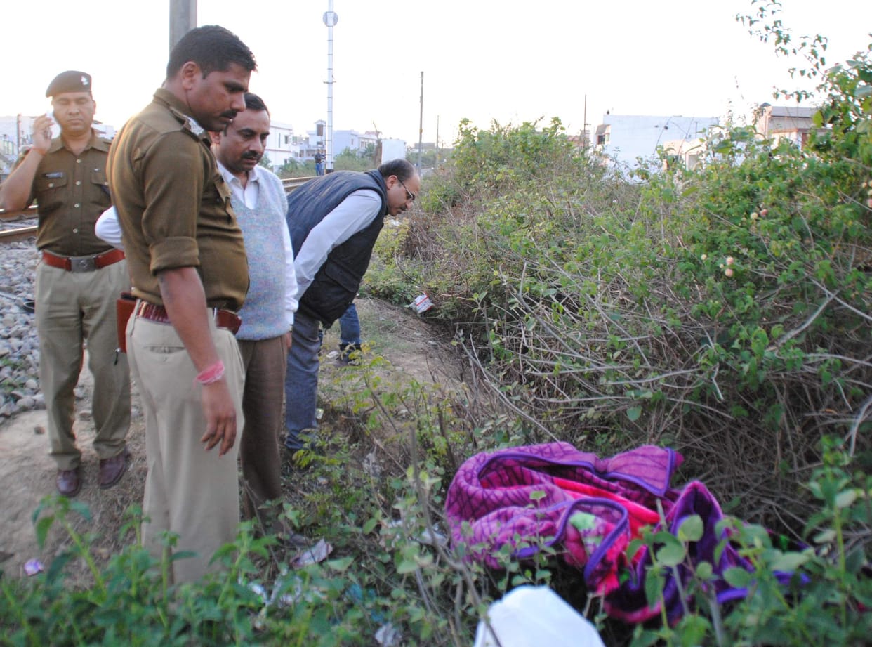 woman dead body found on the side of railway track.