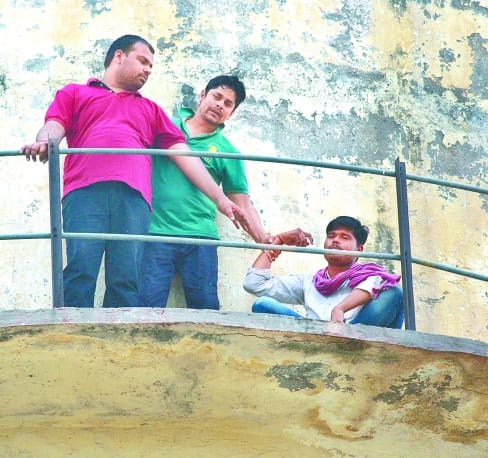 student climb on water tank 