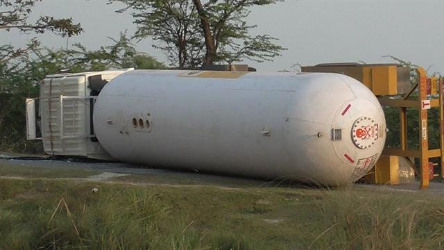 Capsule filled with gas truck overturned on the canal bridge