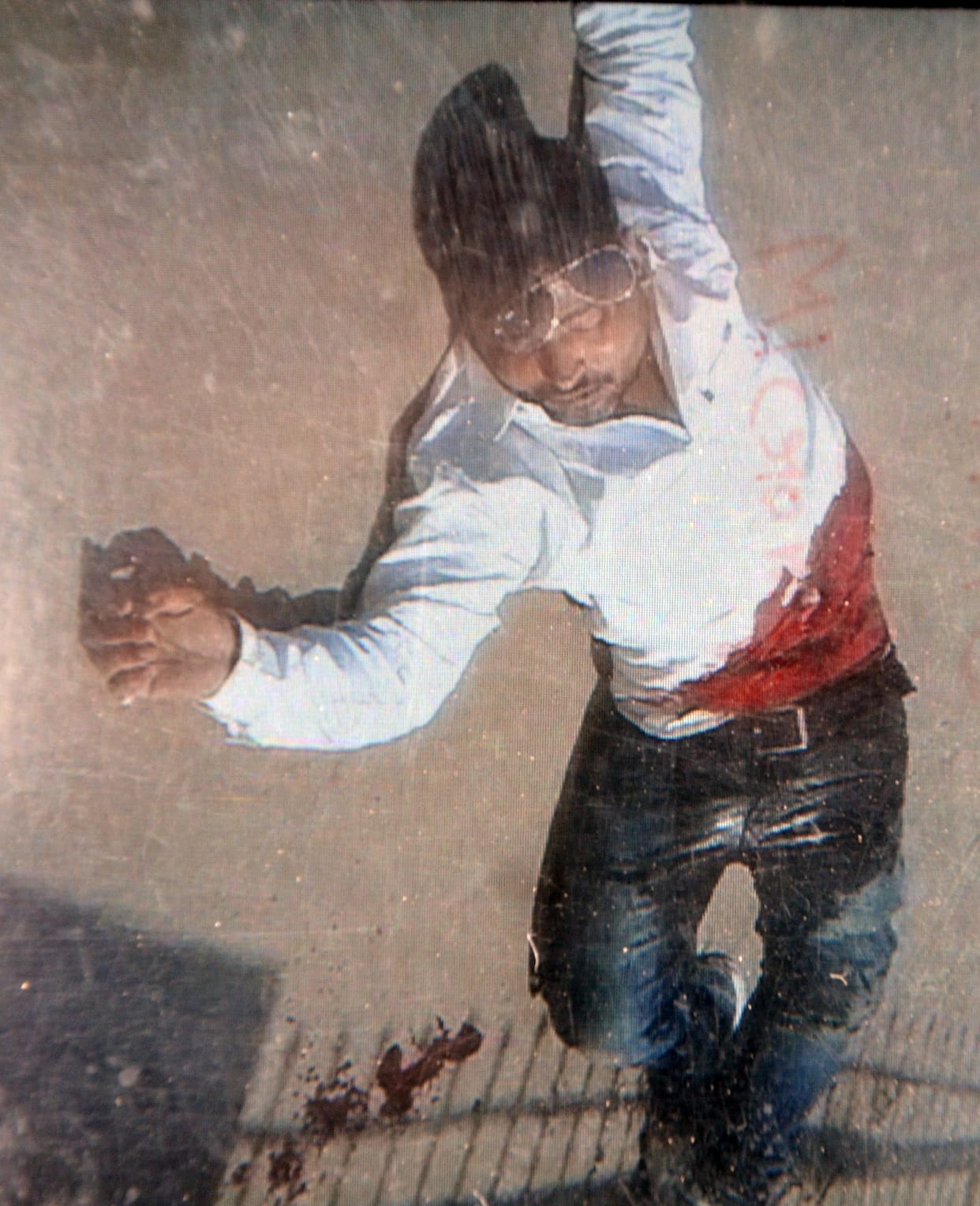  The young man came out of the house shot