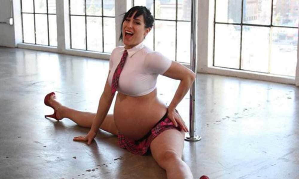 Pregnant Pole dancer poses sexy before delivery