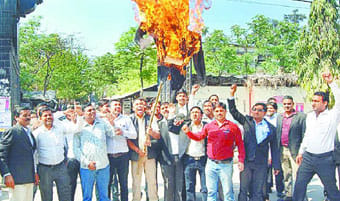 Burned an effigy of Law Minister