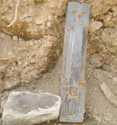 ancient statue in digging of road