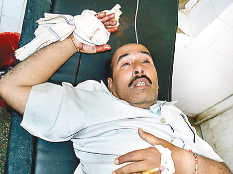 The headmaster of the school in Banda shot inside shot