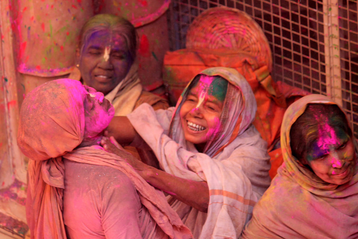 widows in vrindavan enjoying holi