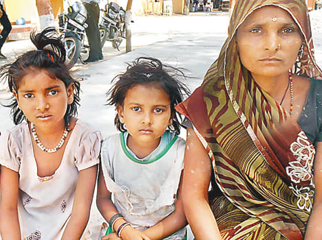 Woman beaten with sticks and daughters