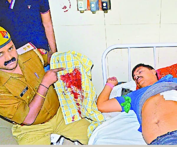 cop shot by mobster in faizabad