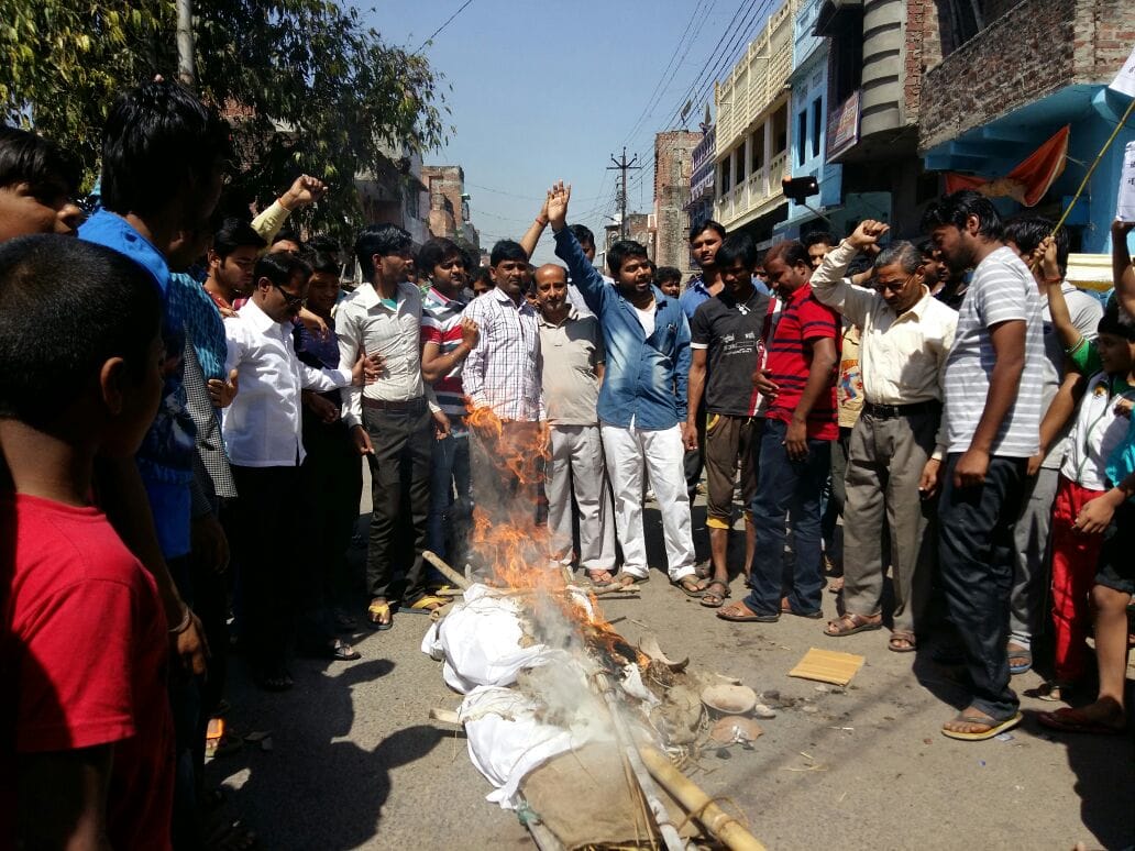Finance, burned an effigy of Prime Minister