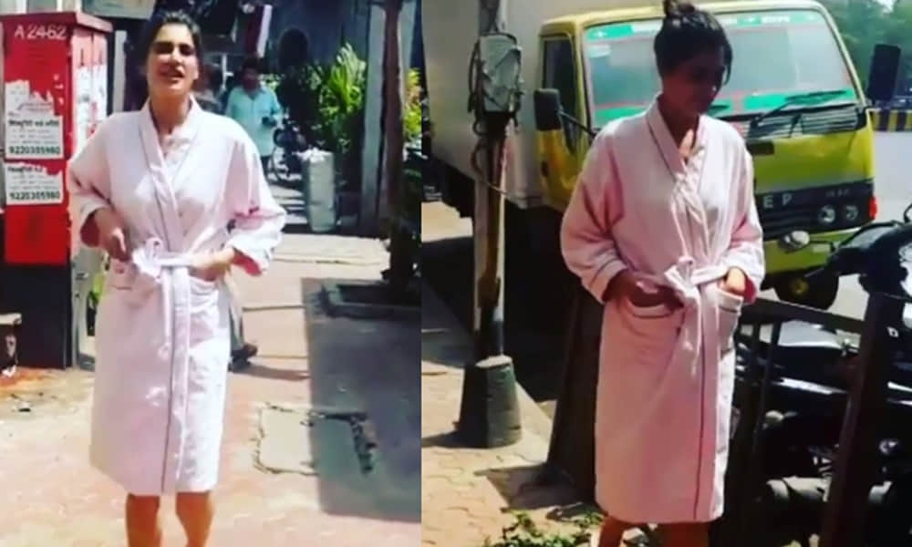 Nargis Fakhri walks in a bathrobe on Mumbai streets