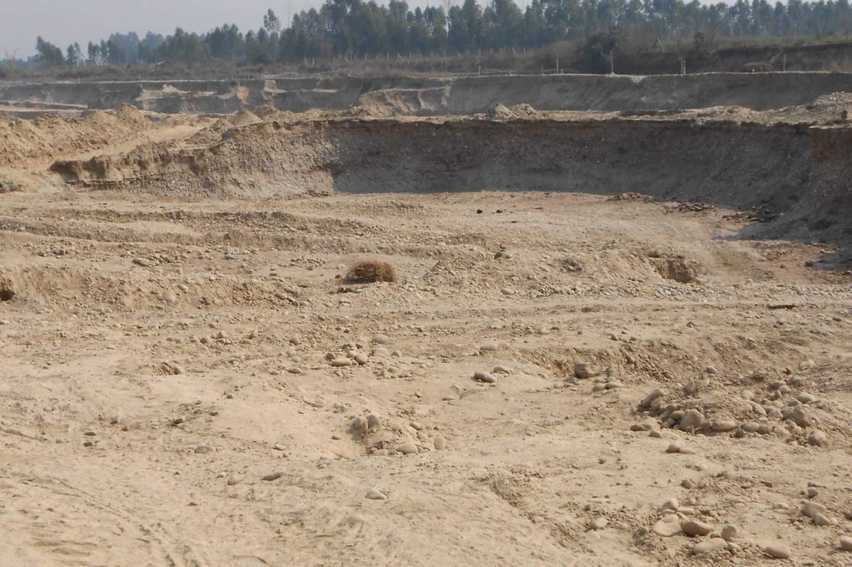a young boy burried under rock, dead