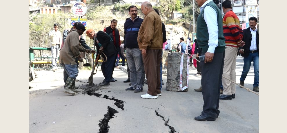 cracks on shimla circular road, traffic jam.