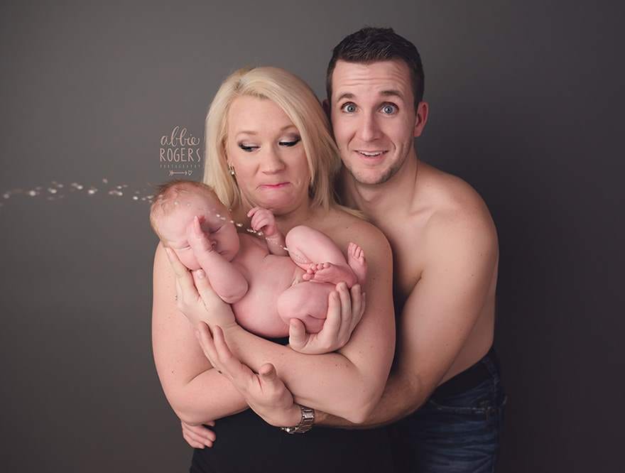 new born pees on mothers lap