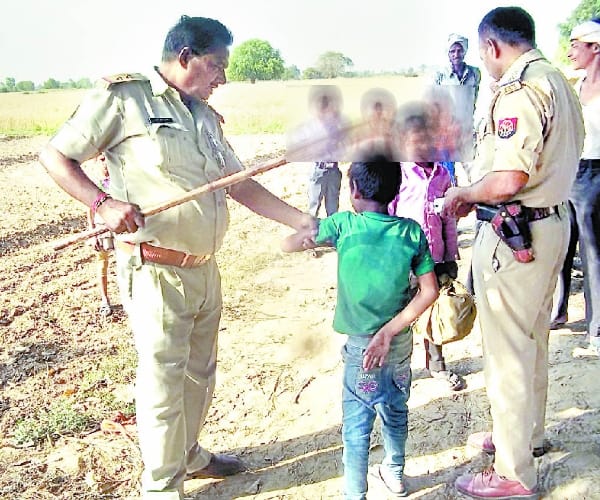 Police beat children in Kanpur.
