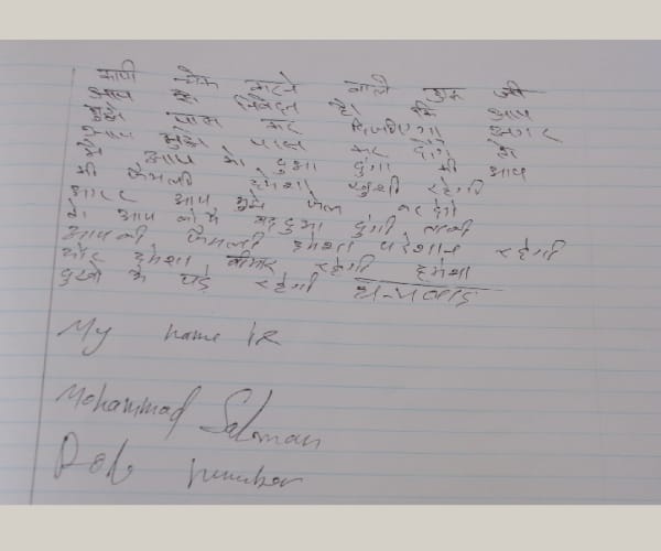 Money in students examination note book.