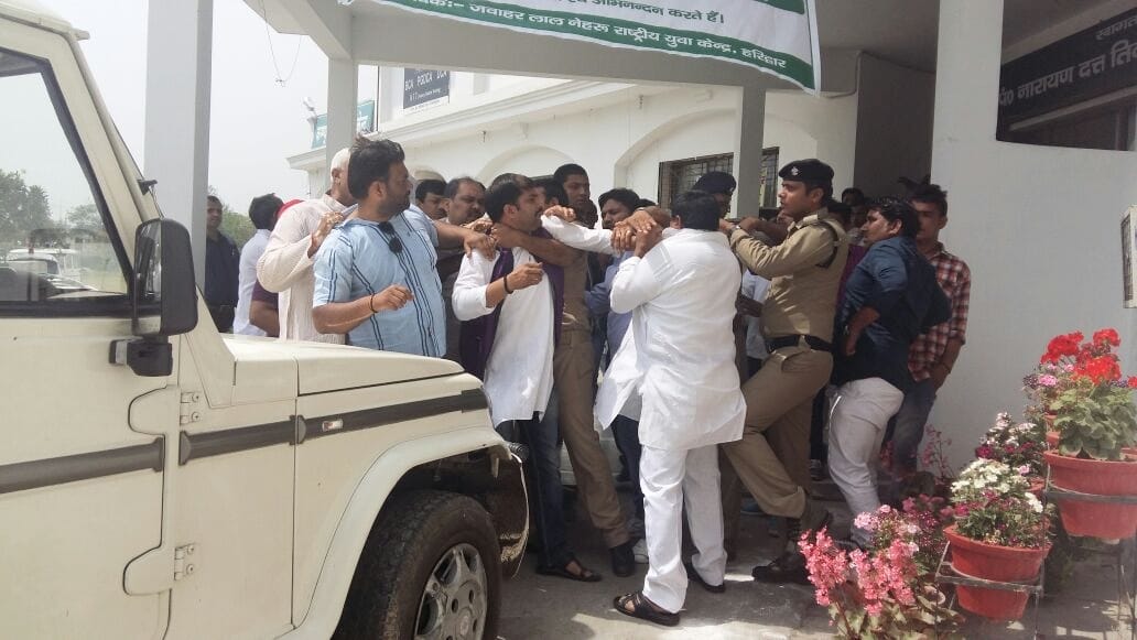 Uproar in open meeting, beaten and stoned