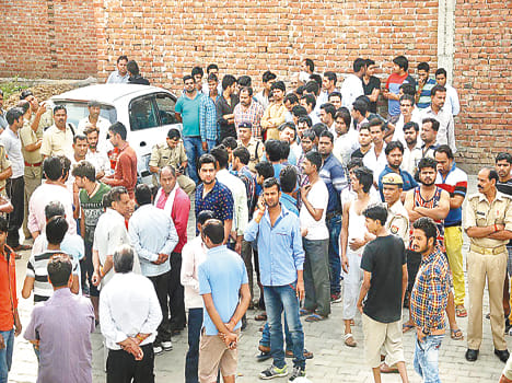 Spokesman strangled, burned bodies poured petrol