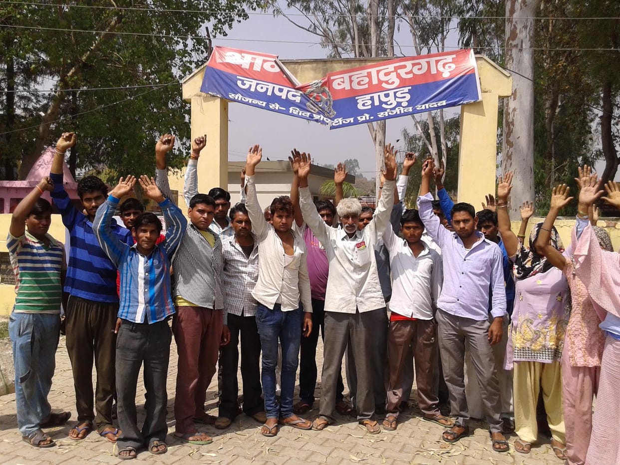 The villagers surrounded the police station.