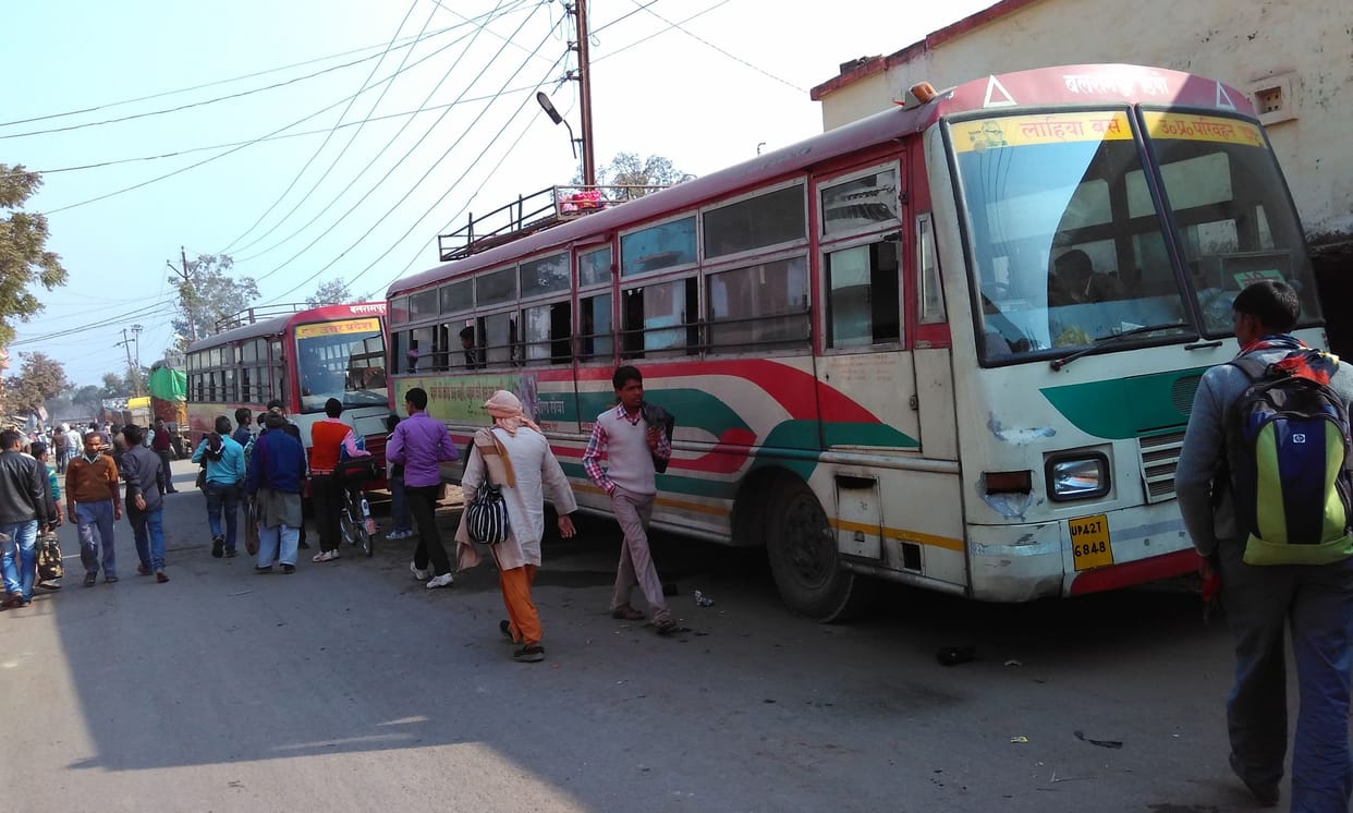 Travelers on the road waiting for the bus