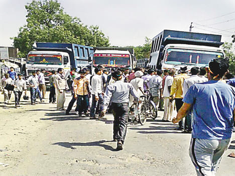 The middle sitting on the edge of the road dumper was thrashed to death