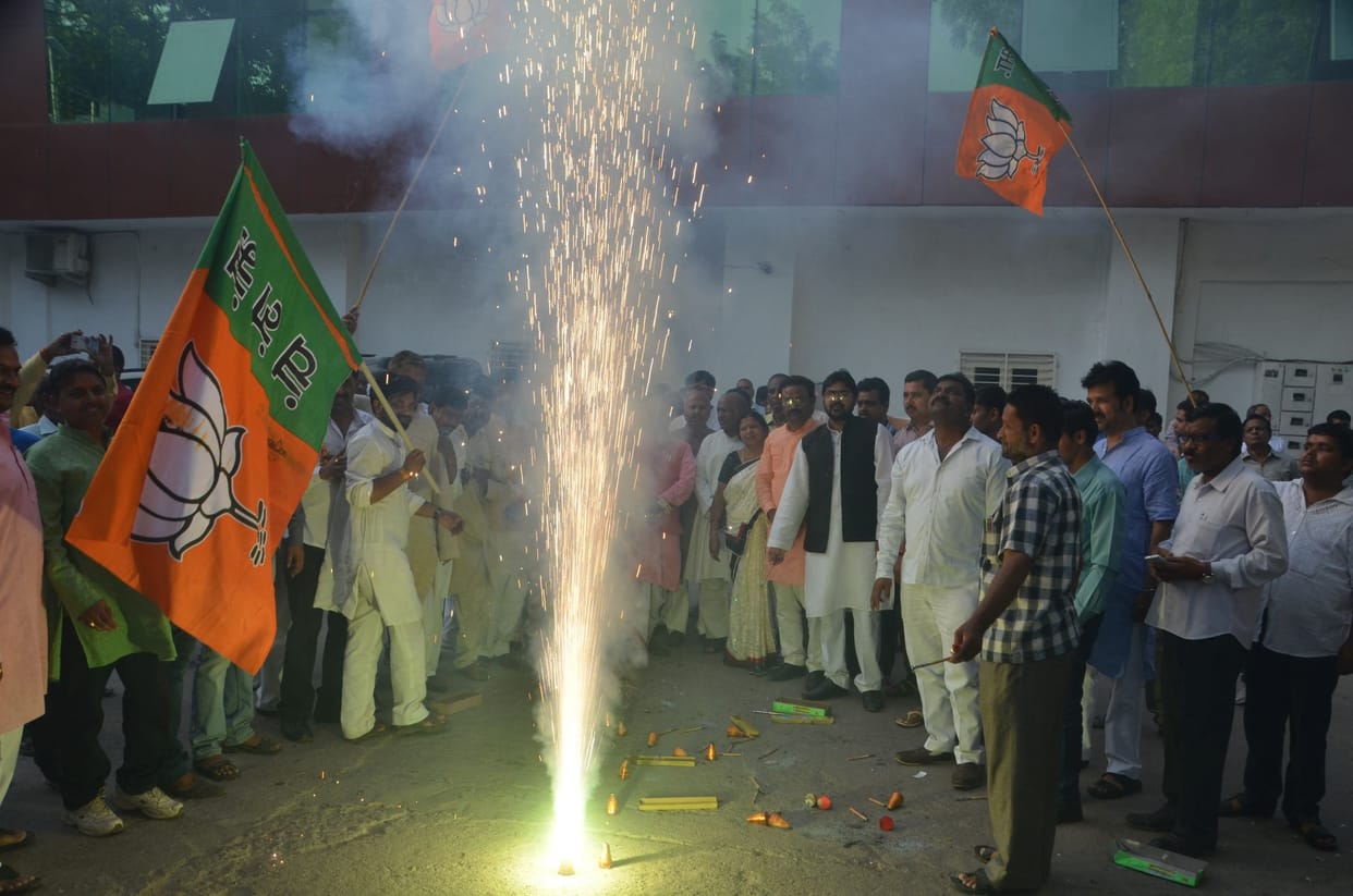 BJP activists celebrate the declaration of its UP president.