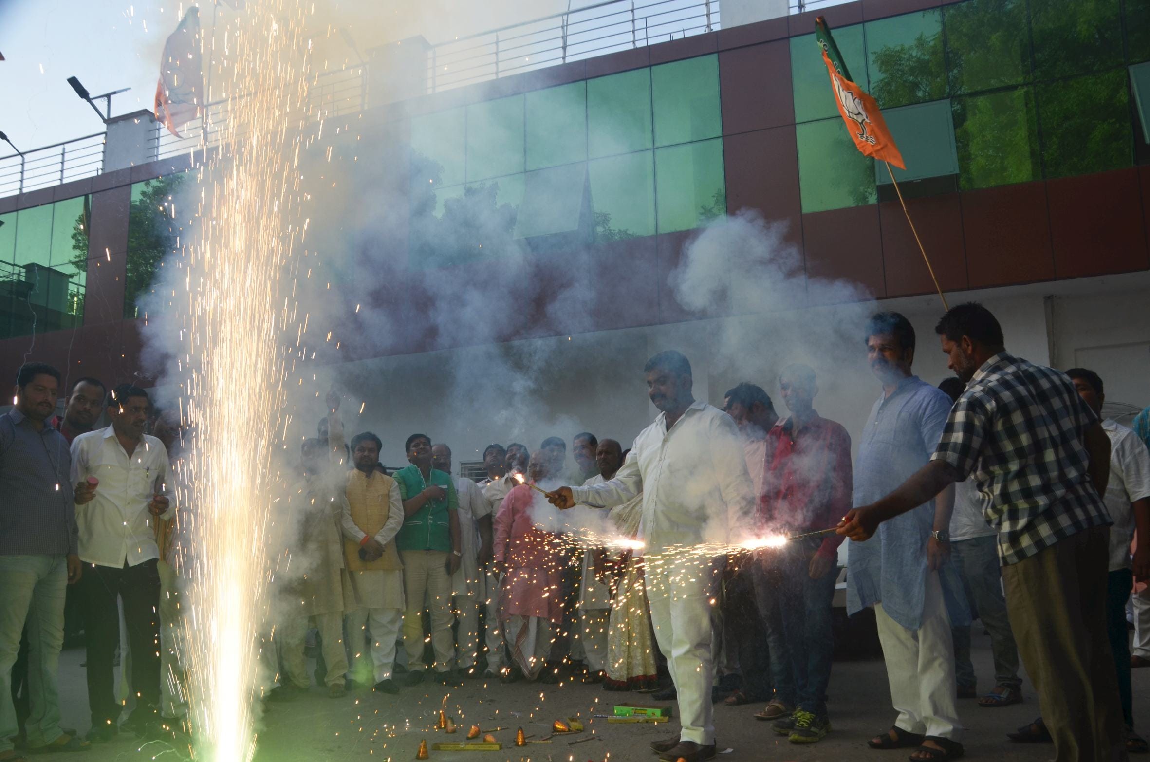 BJP activists celebrate the declaration of its UP president.