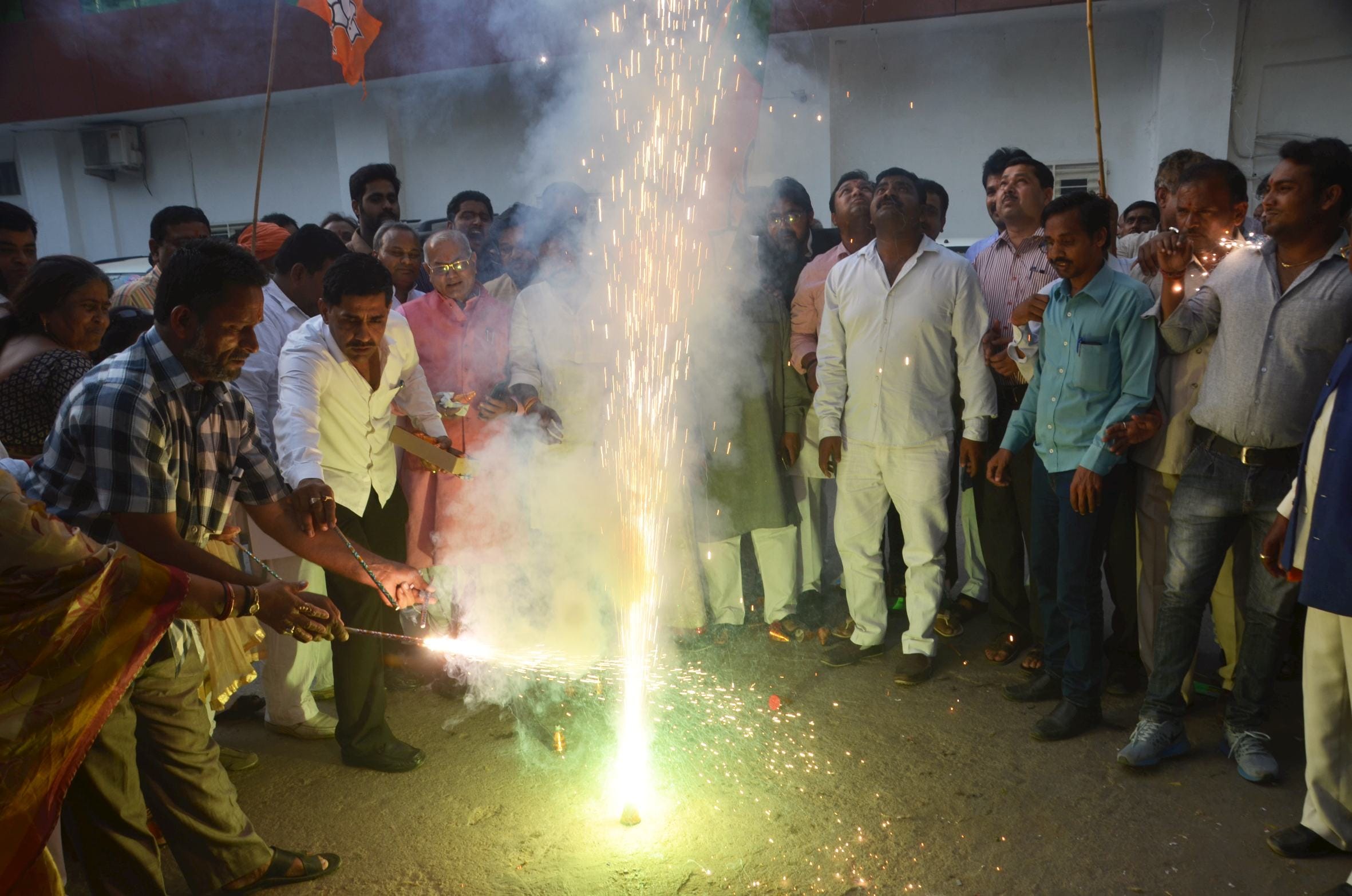 BJP activists celebrate the declaration of its UP president.