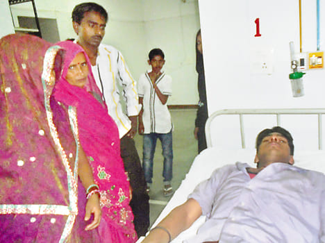 Jhrkhurani with tow young men in roadways bus 