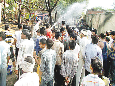 Six house flames charred, scorched three cattle