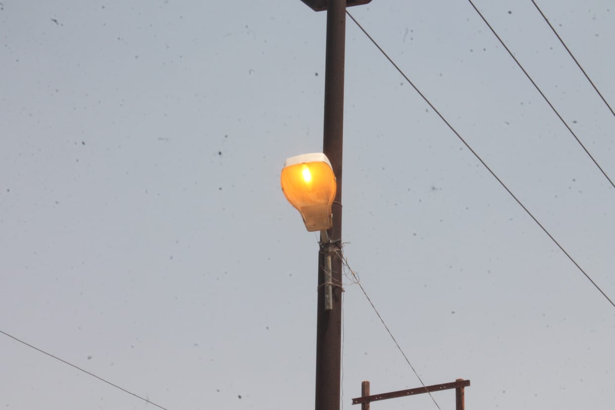 Street lights burning during the day