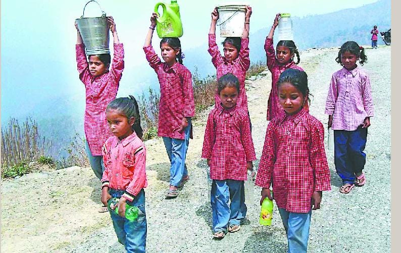 Students in the head a bucket of water