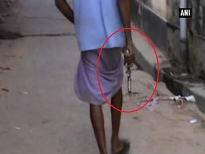 Unidentified man walks around with pistol in poll-bound West Bengal