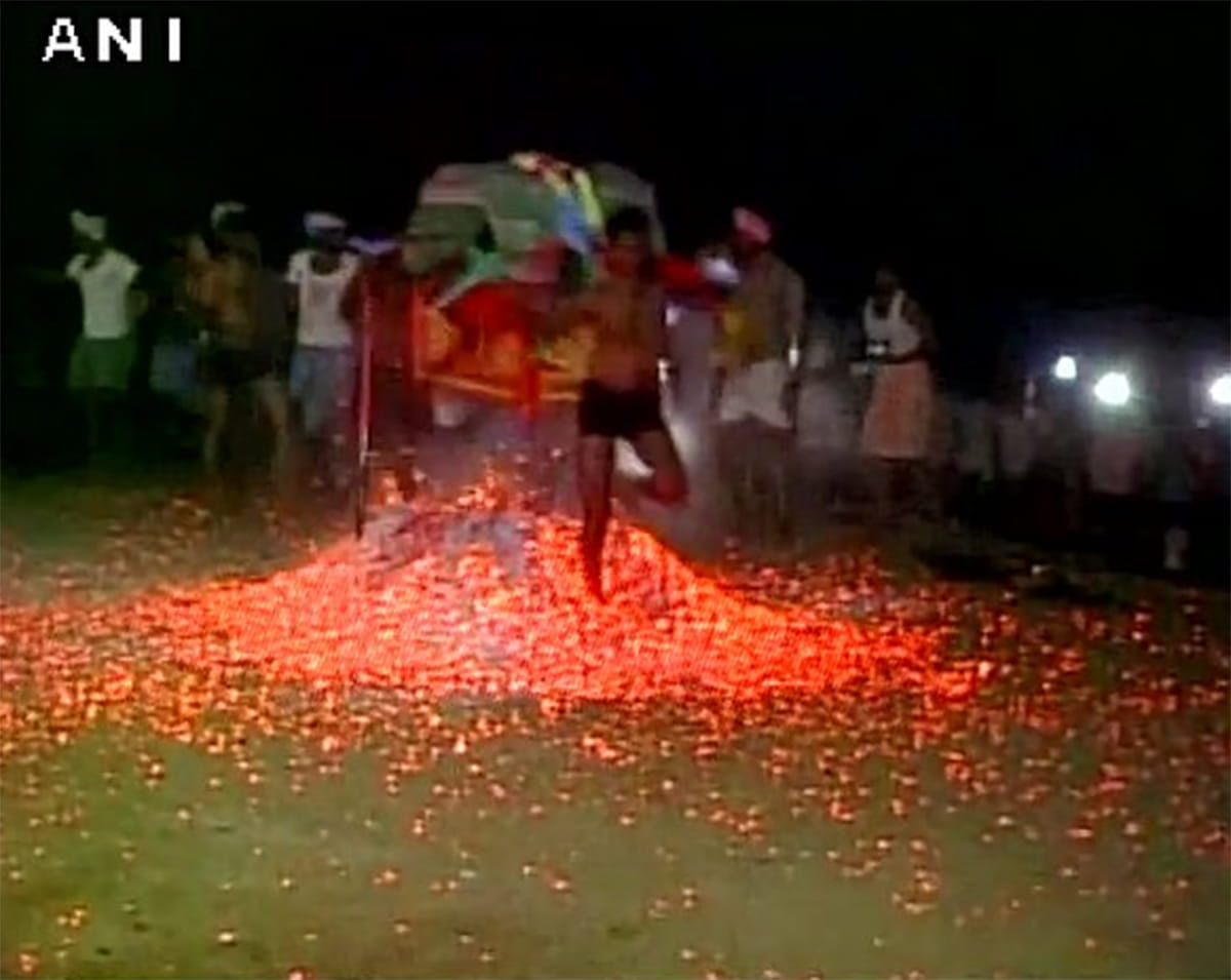 People throw burning embers at each other as a part of Ugadi festival 