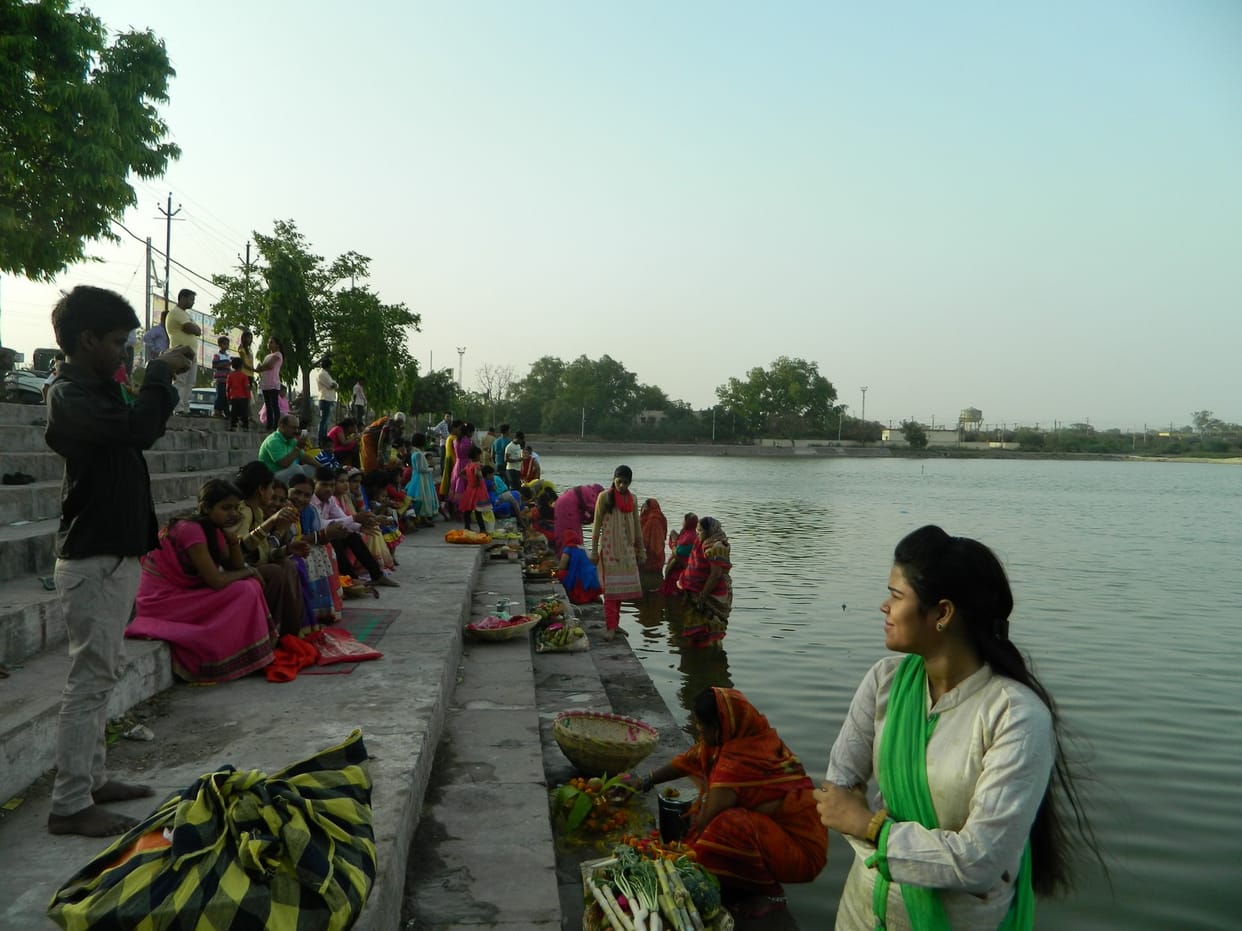 The devotees offer water in the ponds