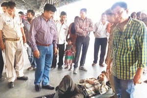young man caught between the train and platform