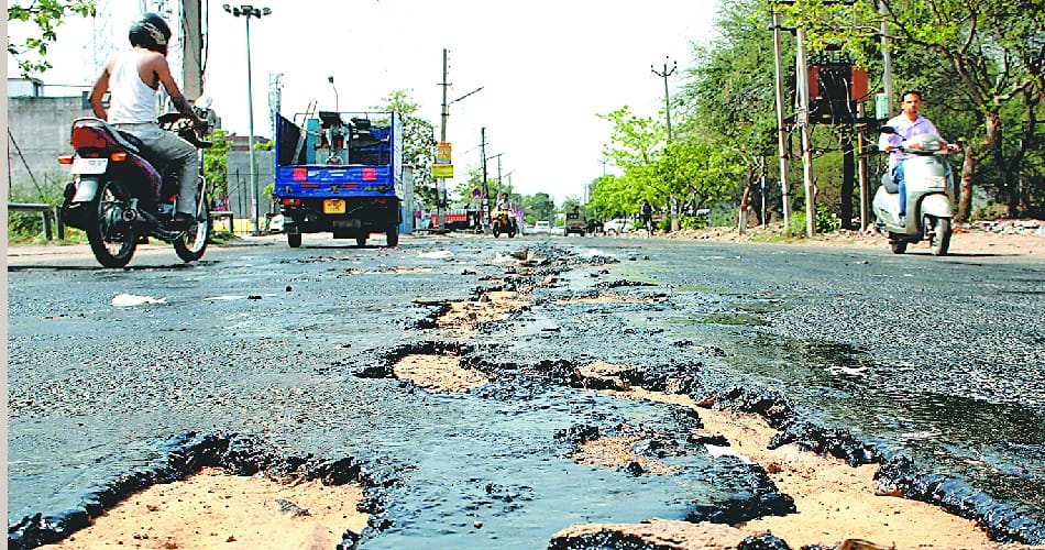 patchwork, crack road after two months in panchkula