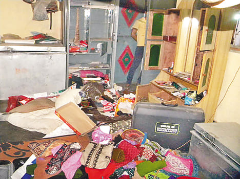Stealing cash and jewelery worth millions of empty houses