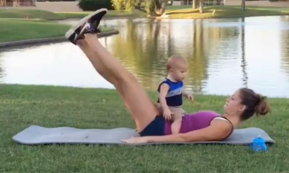 pregnant Woman exercises with 19 months toddler