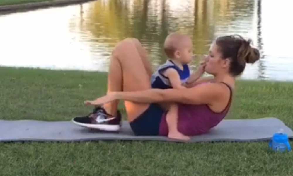 pregnant Woman exercises with 19 months toddler