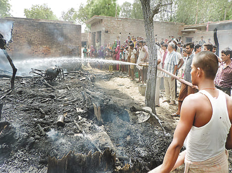 Property worth millions of ash from a fire four houses