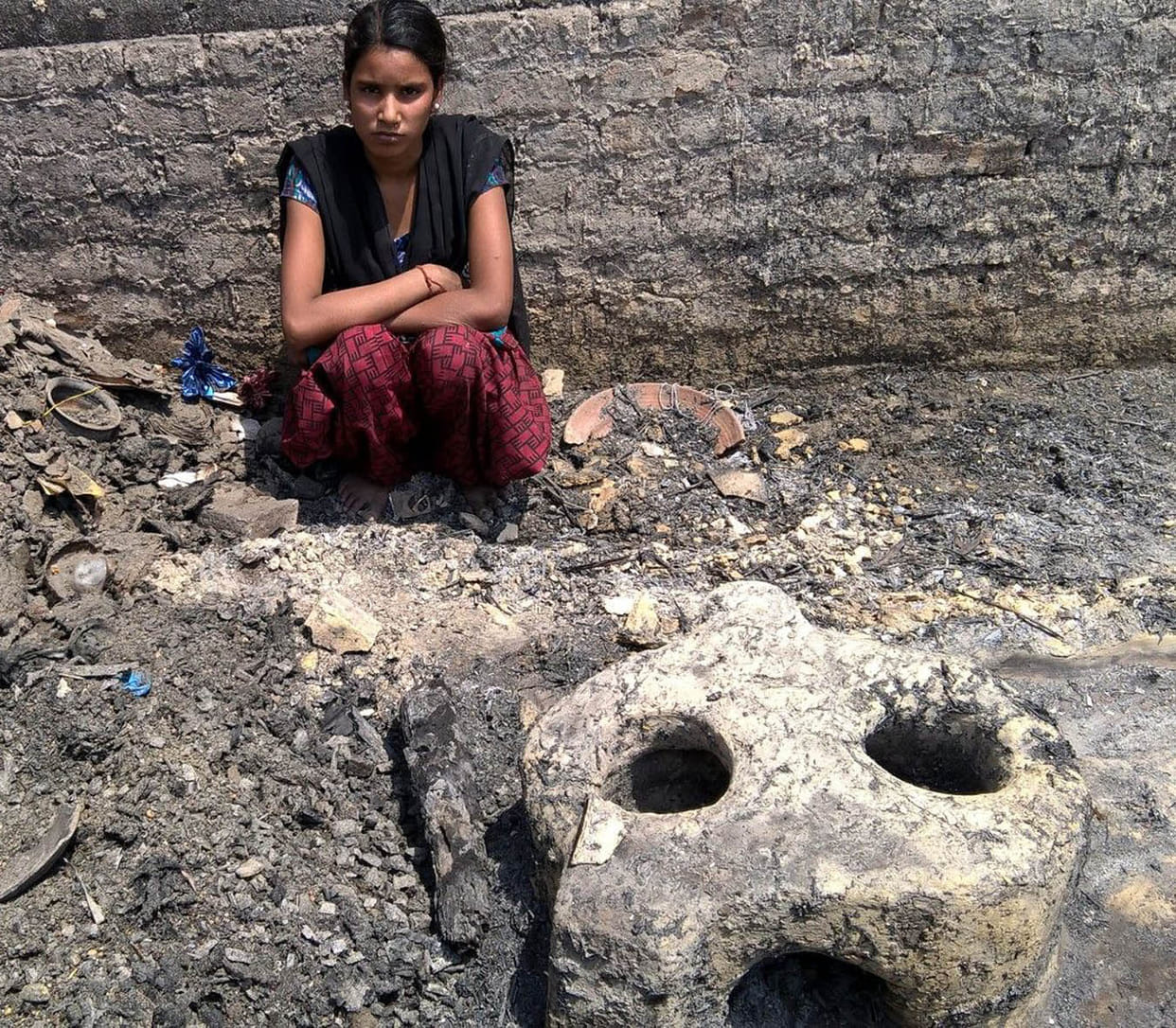 Tear getting cold ashes of homes