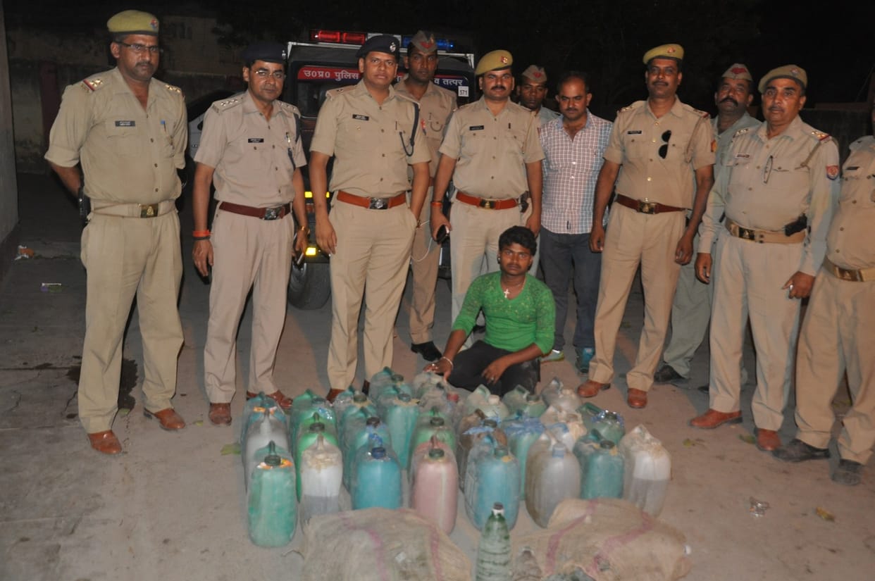 police raid on raw liquor addas