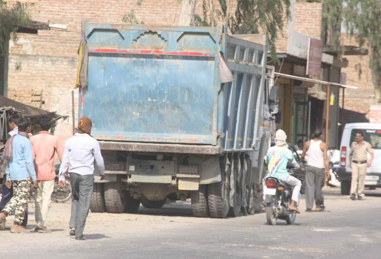 Two trucks collided , killing one