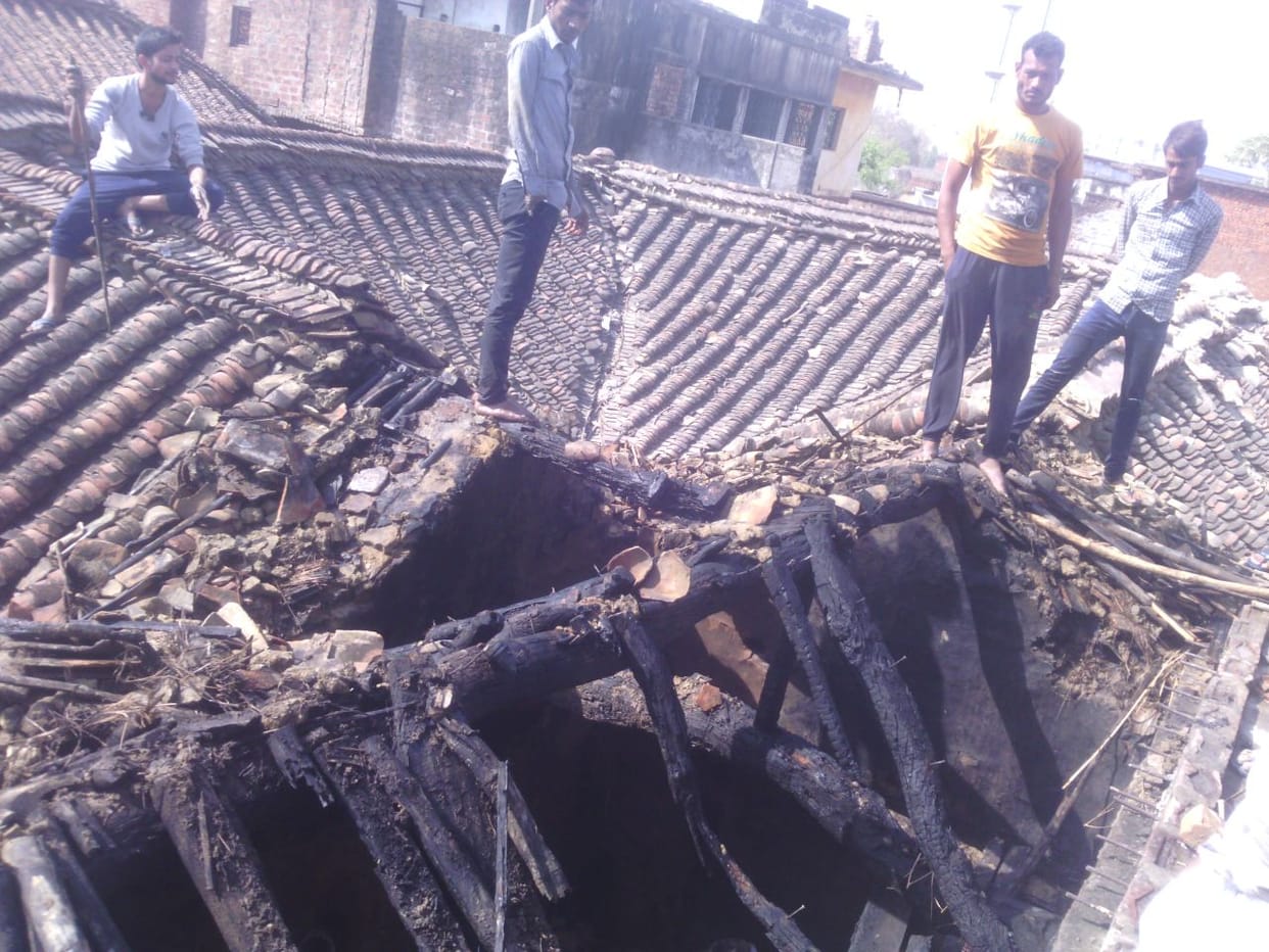 five huts and crops fired 