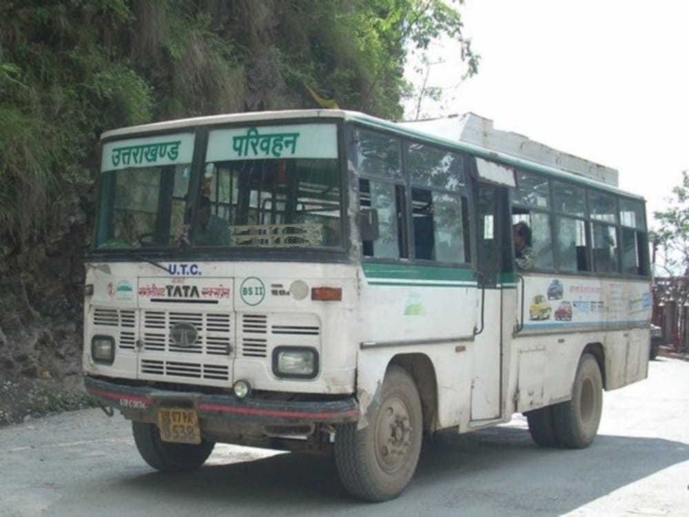 Uttarakhand Roadways Bus Conductor take ticket to senior citizen women