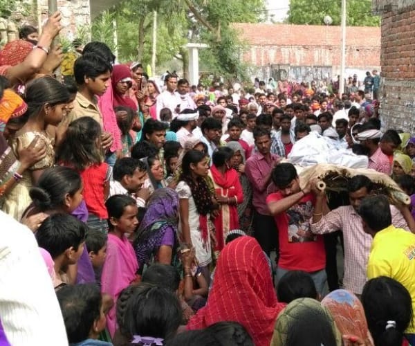 A bus of the procession fired