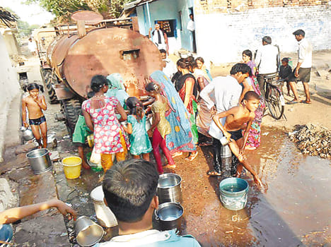 Reaching rural tanker rushed with buckets